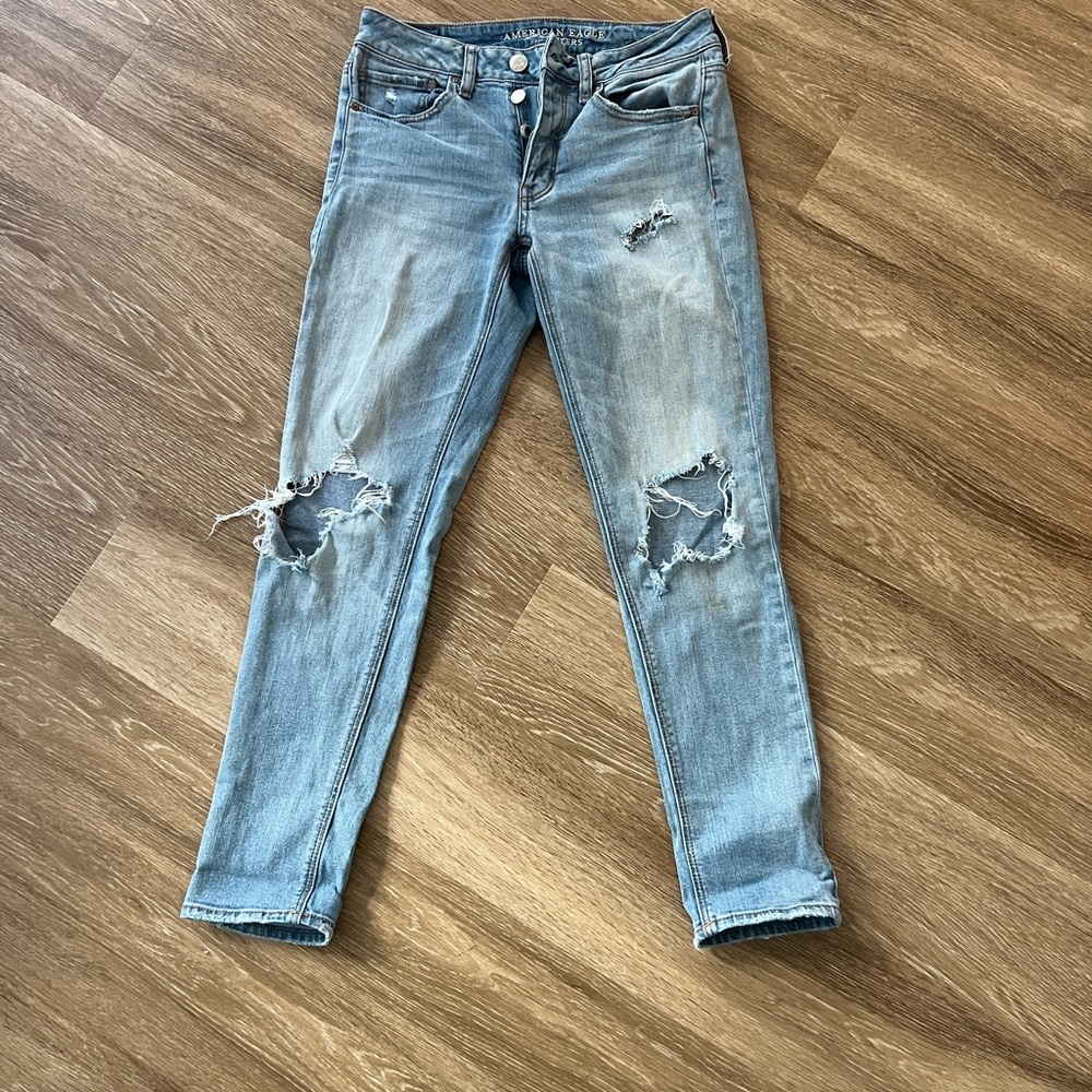 American eagle straight leg pants with rips in the knees size 2 light wash